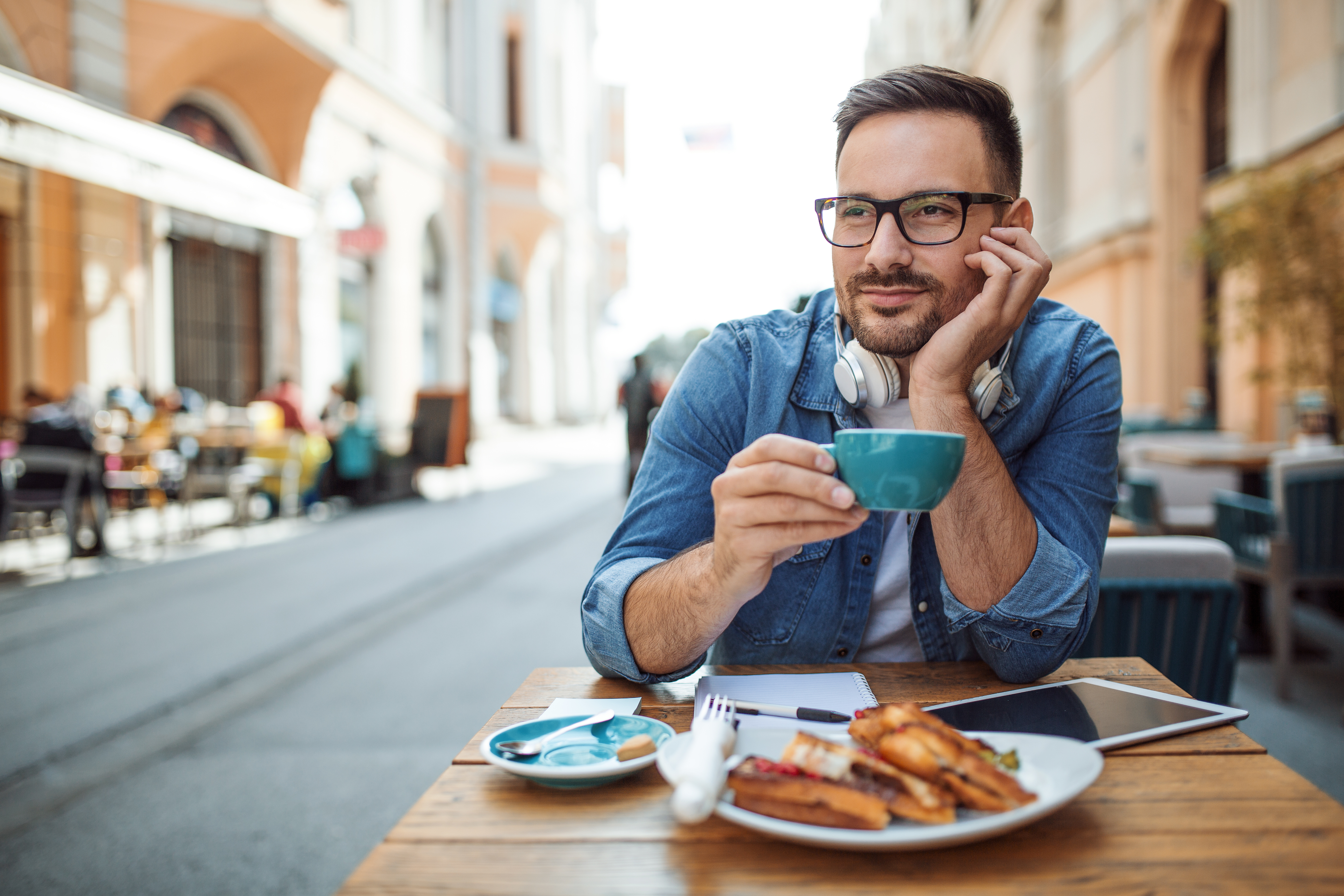 Man at outdoor café with coffee